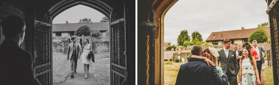 Wedding guests walk towards the church and are greeted by the ushers