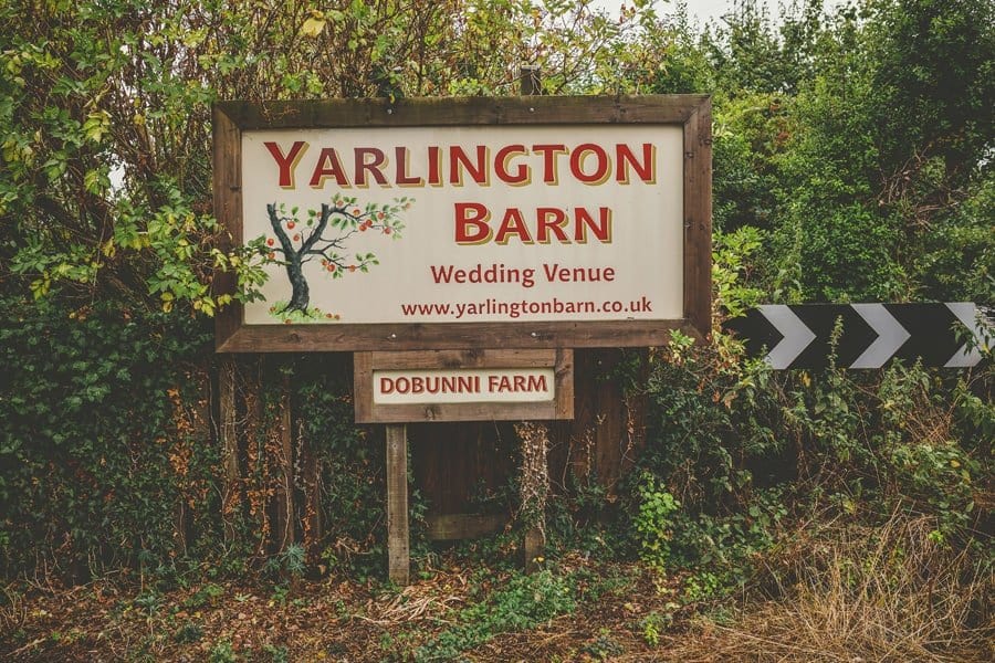 A large wooden sign outside Yarlington Barn in Somerset