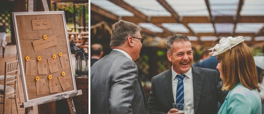 Wedding guests chatting to each other at Yarlington barn in Somerset