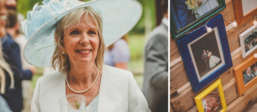 The bride's mother smiles as she poses for a photograph