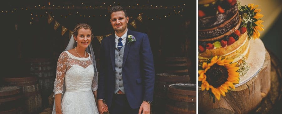 The bride and groom pose for a photograph at Yarlington barn in Somerset
