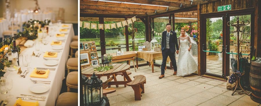 The bride and groom hold each others hand and enter the barn together