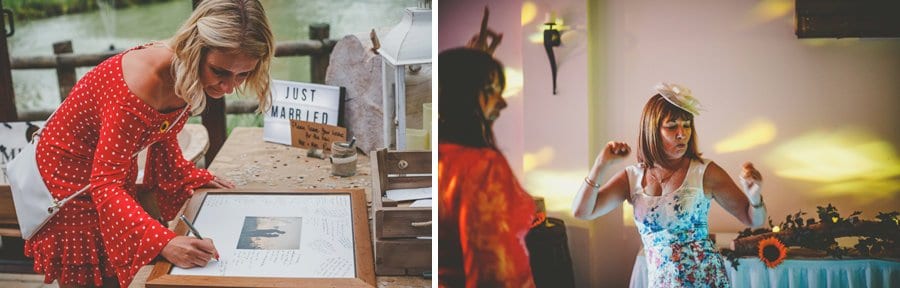 A wedding guest signs a framed photograph of the couple on a small wooden table at Yarlington barn in Somerset