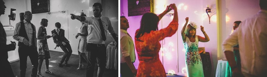 Wedding guests on the dancefloor in the old barn