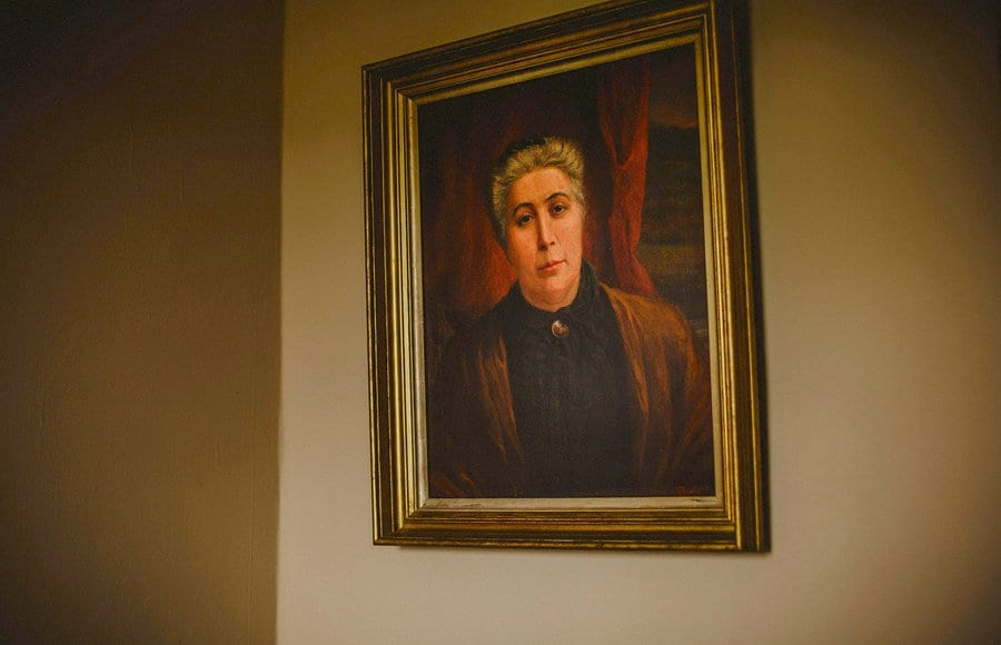 An oil painting hangs from a wall in the brides mother's house