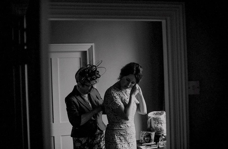 The brides sister and her mother get ready together