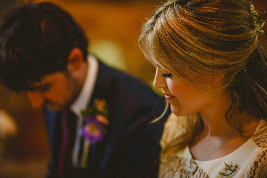 The wedding couple take their vows