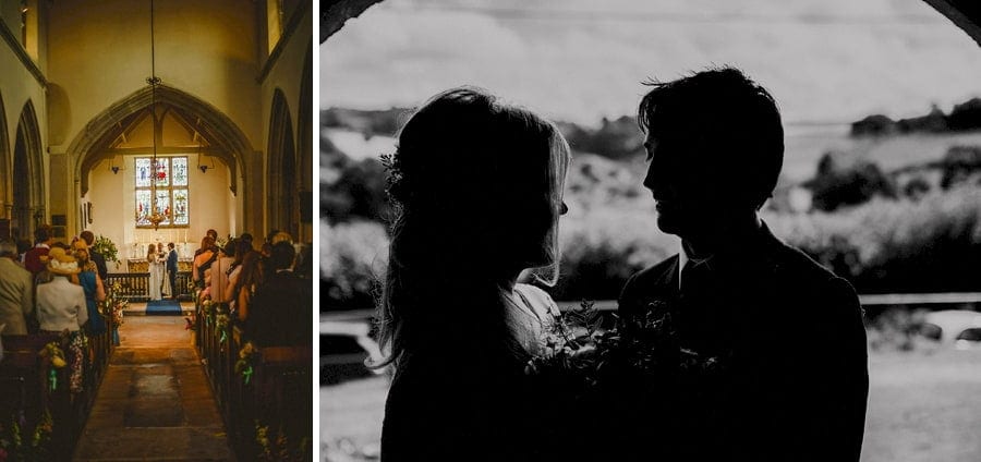 The bride and groom stand underneath the church door and look at each other
