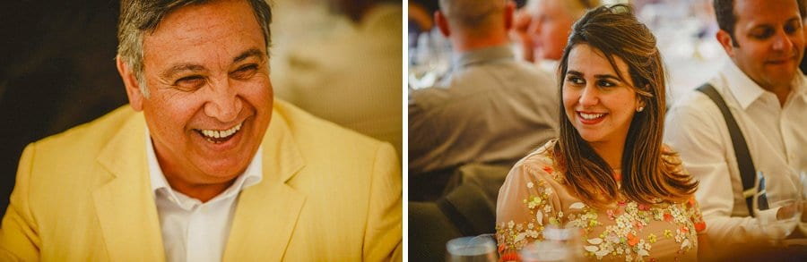 Wedding guests laughing at the speeches in the marquee