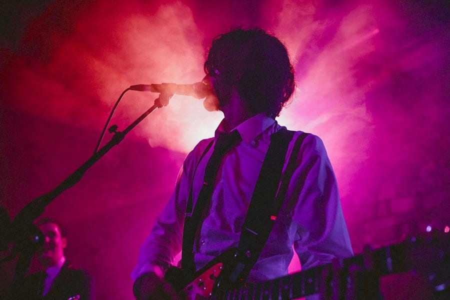 The grooms brother plays bass guitar on stage