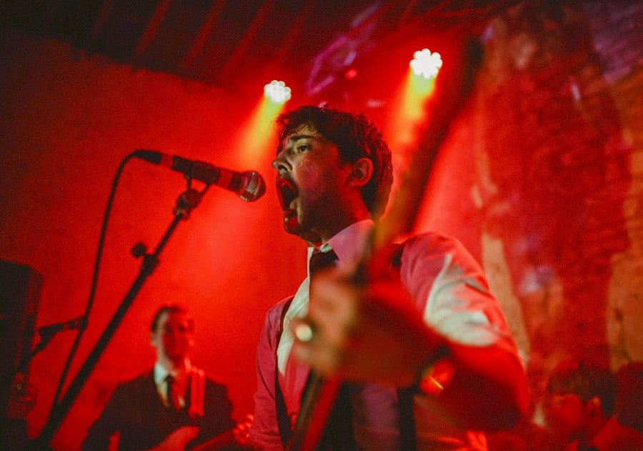 The groom singing on stage