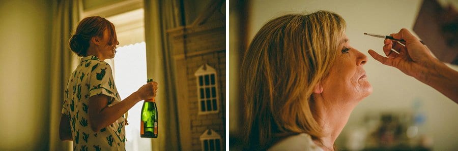 A bridesmaid picks up a bottle of champagne