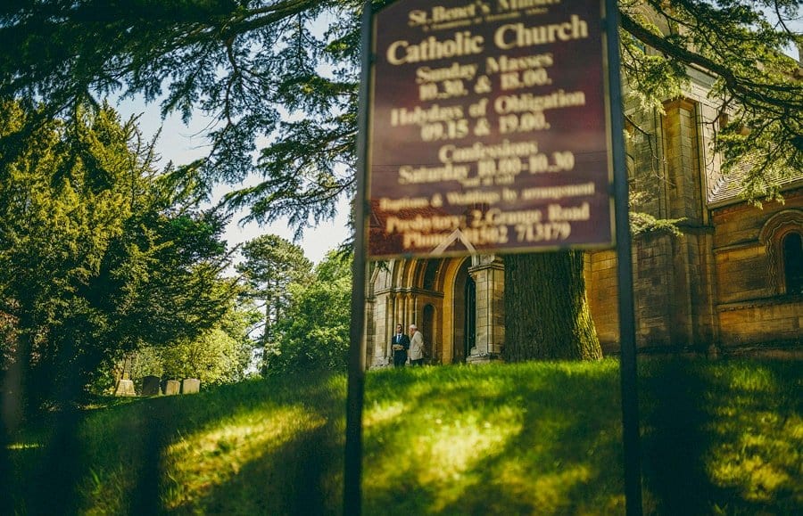 An usher outside St. Benets Minster, Suffolk