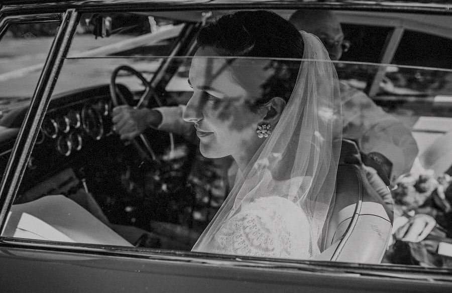 The bride arrives outside St. Benets Minster, Suffolk