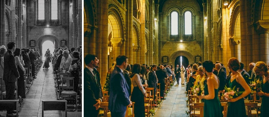 The bride and her father walk down the aisle of St. Benets Minster, Suffolk