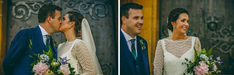 The bride and groom outside church at St. Benets Minster in Suffolk