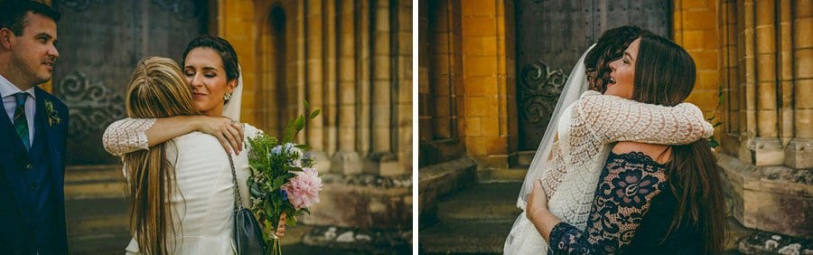 The bride hugs a member of the family
