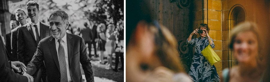 A wedding guest takes a photograph on her camera