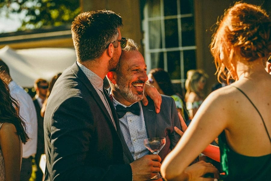 Weddings guests drinking champagne and chatting with friends at Wilderness Reserve
