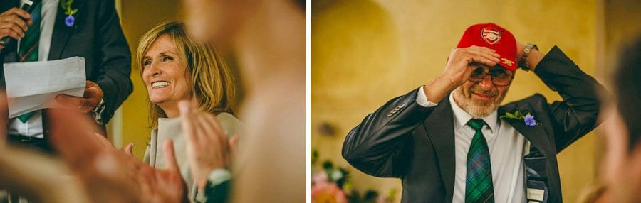 The brides father puts a cap on during his speech