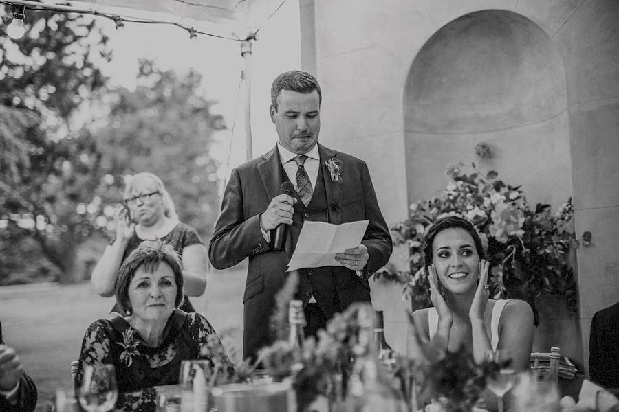 The groom pulls his face while reading his speech