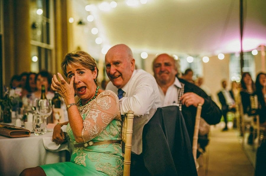 A wedding guest cries with laughter at the best mans speech