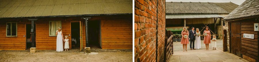 The bride and her daughter pose for a photograph in the courtyard