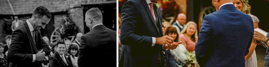 The best man gives the groom the wedding rings during the outdoor wedding ceremony