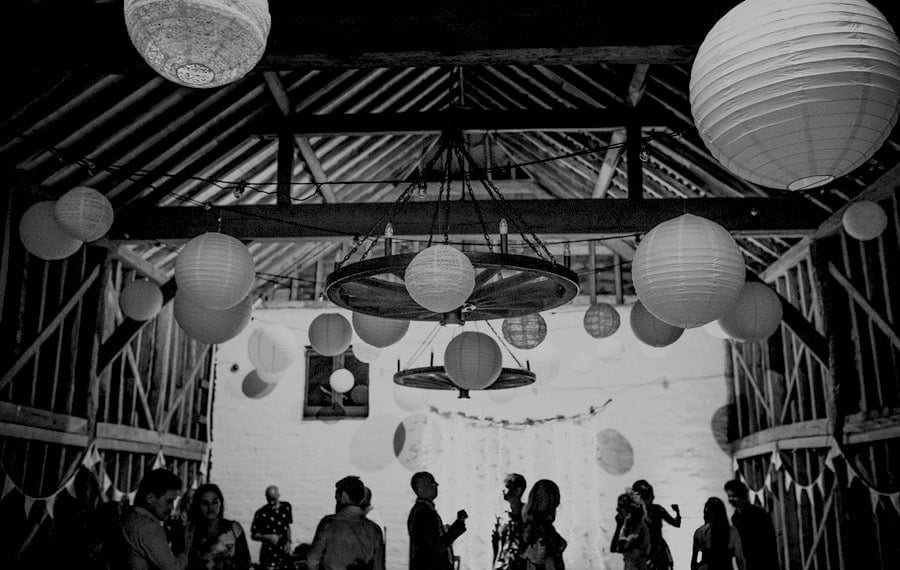 Wedding guests dancing at Over Barn in Gloucestershire