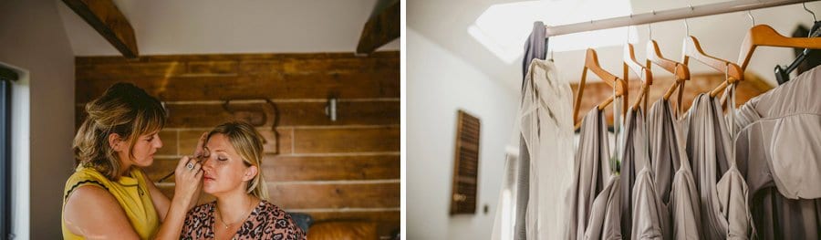 The makeup artist applies make up to the face of one of the bridesmaids