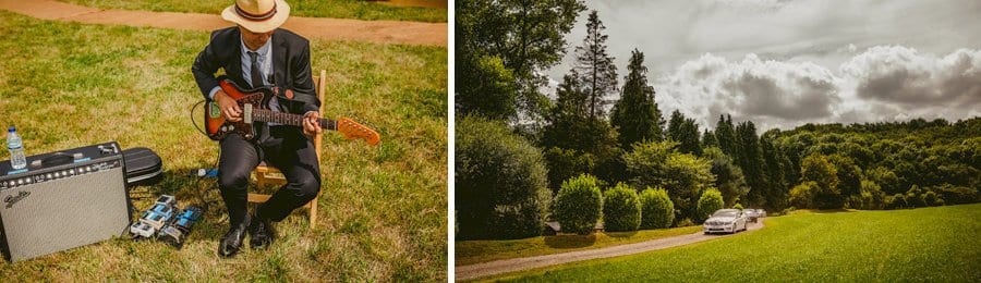 A guitarist plays his guitar as the wedding car with the bride in it arrives in the large open field