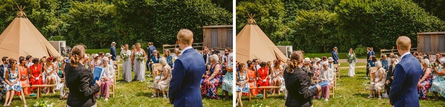 The bridesmaids walk up the aisle of the outdoor ceremony