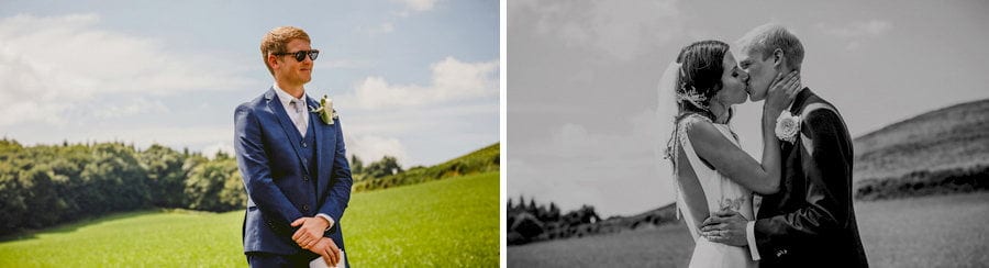 The bride and groom kiss each other during the outdoor wedding ceremony
