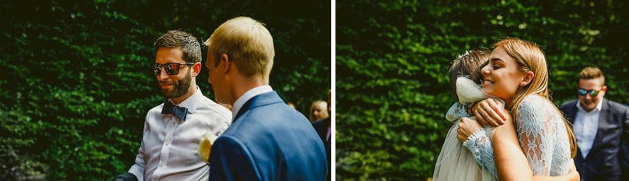 A wedding guest puts her arms around the bride