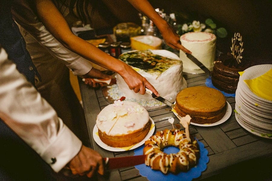 The bride and groom cut the wedding cakes in the tipi at yurt retreat