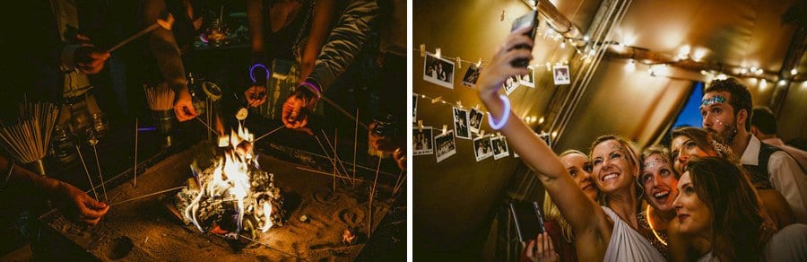 A bridesmaid holds a mobile phone in her hand and takes a photograph of herself and her friends in the tipi at yurt retreat in Crewkerne in Somerset
