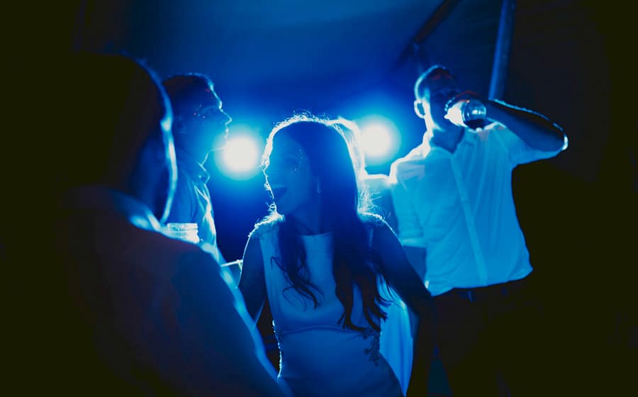 The bride dancing with friends and family