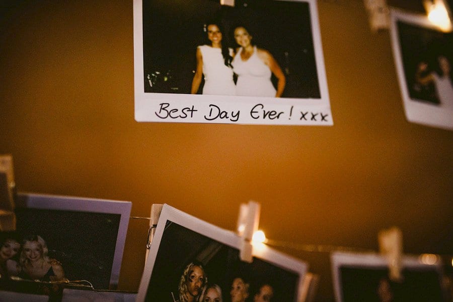 A polaroid photograph hangs from a piece of string in the tipi