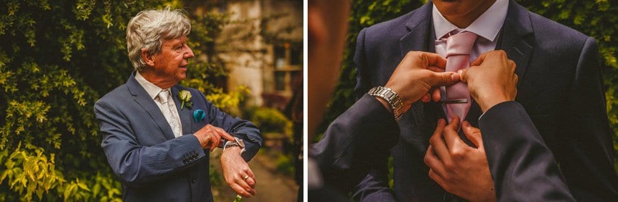The brides father looks at his watch and a lady straightens an ushers tie