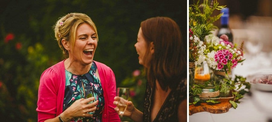 A lady laughs with her friend in the gardens at Abbey House