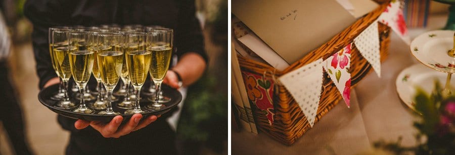 A member of staff at Abbey House gardens holds a tray of champagne flutes