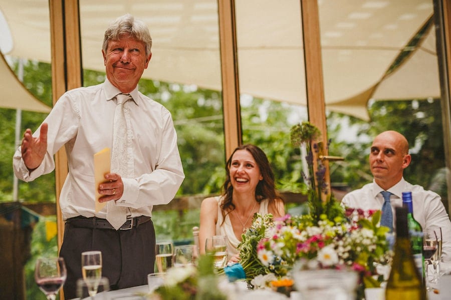 The brides father stands up and delivers his speech