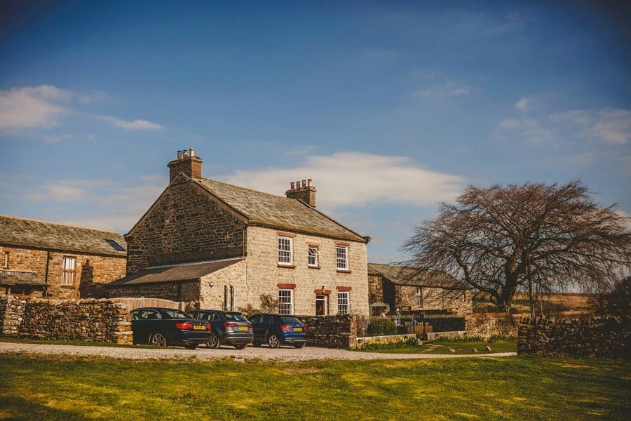 A cottage in Kirkby Stephen with cars parked outside