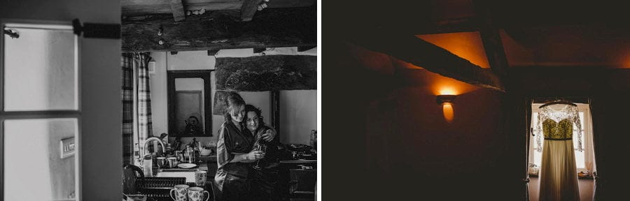 Two bridesmaids hug each other in the kitchen