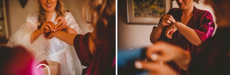 Bridesmaids put on bracelets given as wedding gifts by the bride and groom