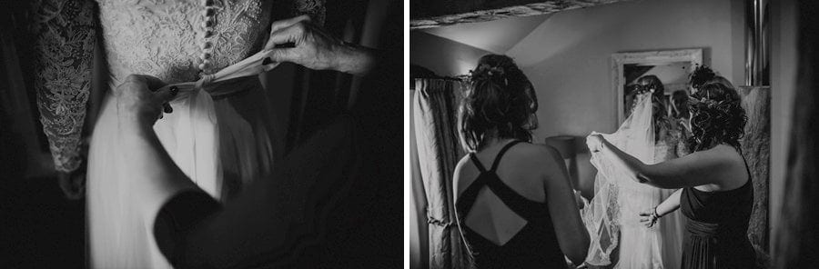 Bridesmaids pull the bride's veil back across the bedroom