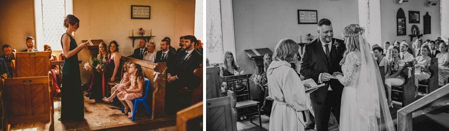 The groom places a wedding ring on the finger of the bride during the wedding ceremony