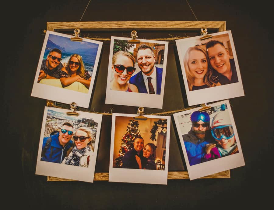 Polaroid prints on a wooden frame of the bride and groom