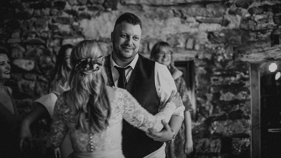 The bride and groom dancing together at Eden Barn