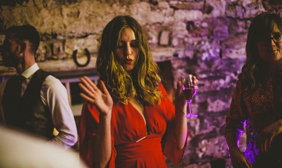 A wedding guest dancing at Eden Barn
